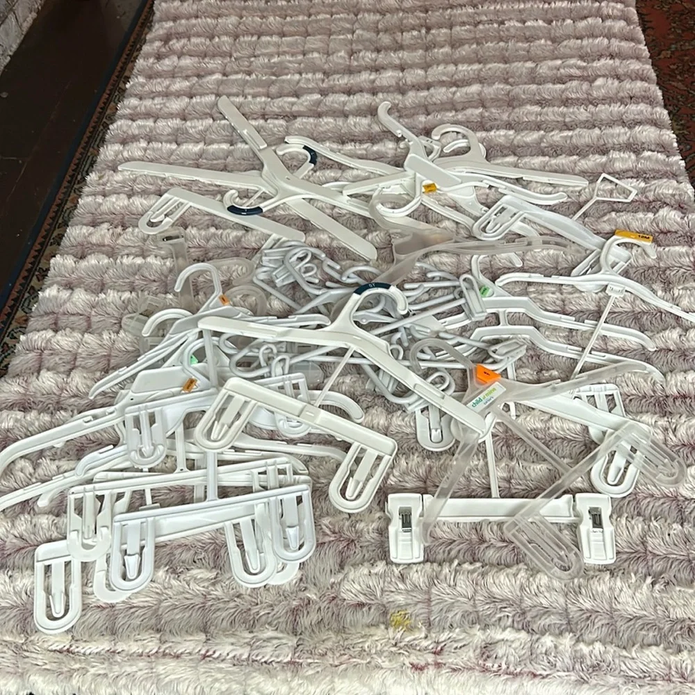 28 kids plastic hangers All white , all different